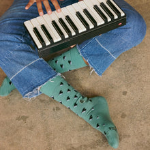 Socks That Support Music (Green Pianos)