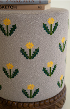 Grey Upholstered Ottoman with Embroidered Detail and Carved Wood Base